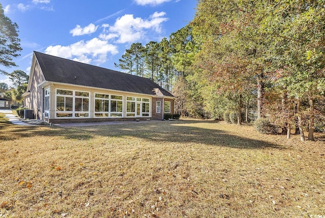 5603 Leatherleaf Dr, North Myrtle Beach, SC 29582 - rear view of house featuring a yard and a shingled roof