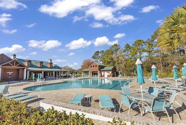 view of swimming pool with a patio area