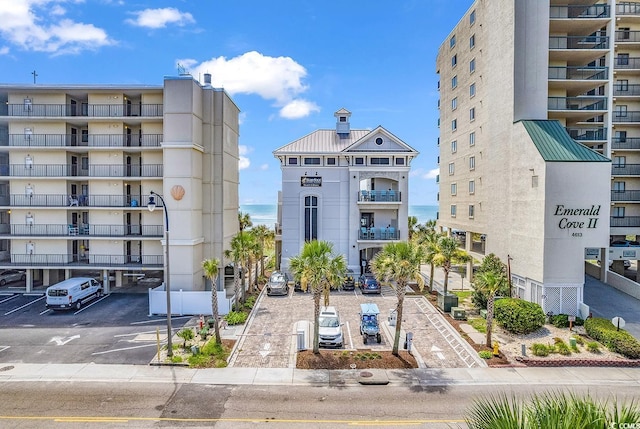 5603 Leatherleaf Dr, North Myrtle Beach, SC 29582 - view of apartment building / complex featuring uncovered parking