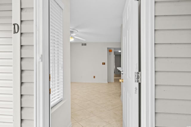 property entrance with ceiling fan