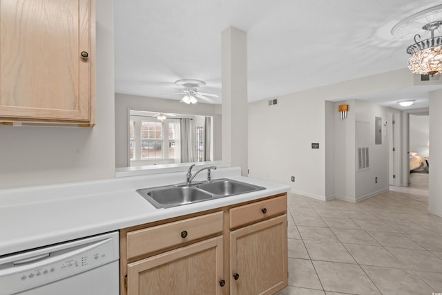 kitchen featuring white dishwasher, ceiling fan, sink, light brown cabinets, and light tile patterned floors