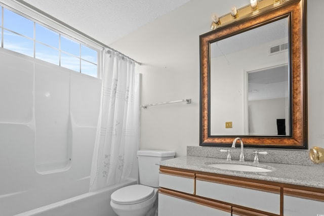 full bathroom featuring vanity, shower / bath combination with curtain, a textured ceiling, and toilet