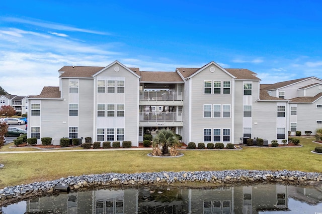 view of building exterior featuring a water view