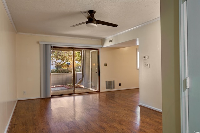 unfurnished room with ornamental molding, a textured ceiling, ceiling fan, and dark wood-type flooring