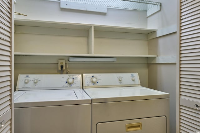 clothes washing area with independent washer and dryer