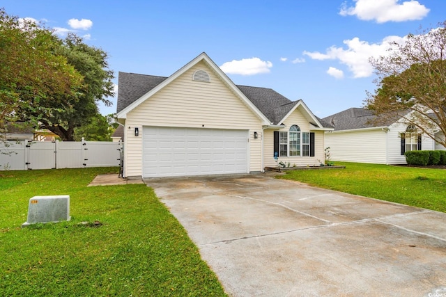 view of front of property featuring a garage and a front yard