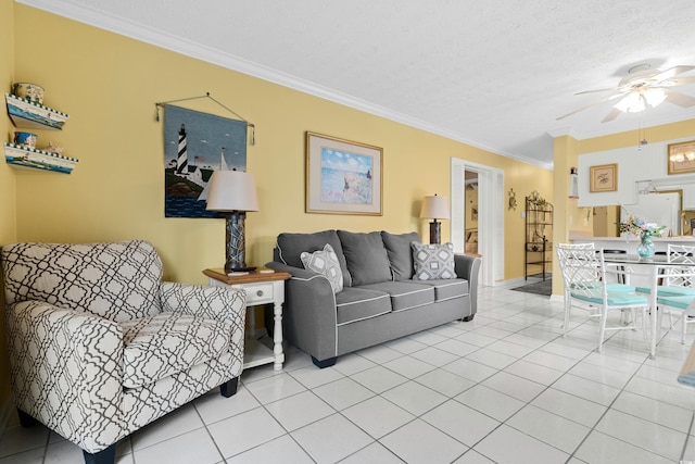 living room featuring a textured ceiling, ceiling fan, crown molding, and light tile patterned flooring