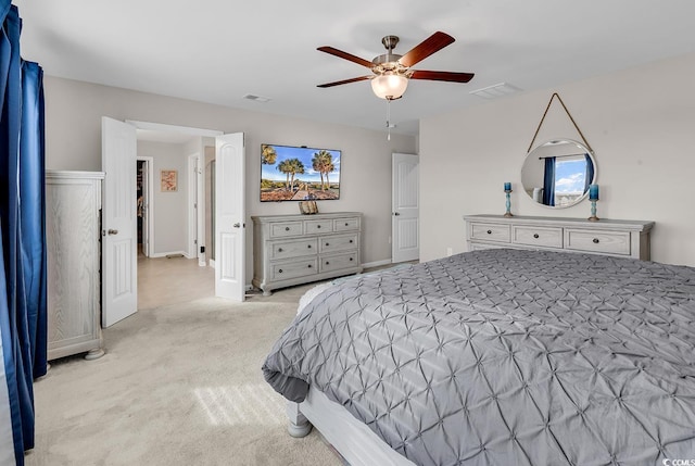 bedroom with ceiling fan and light colored carpet