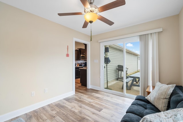 unfurnished living room with ceiling fan and light hardwood / wood-style floors