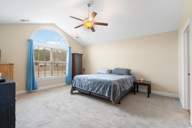 carpeted bedroom with vaulted ceiling and ceiling fan