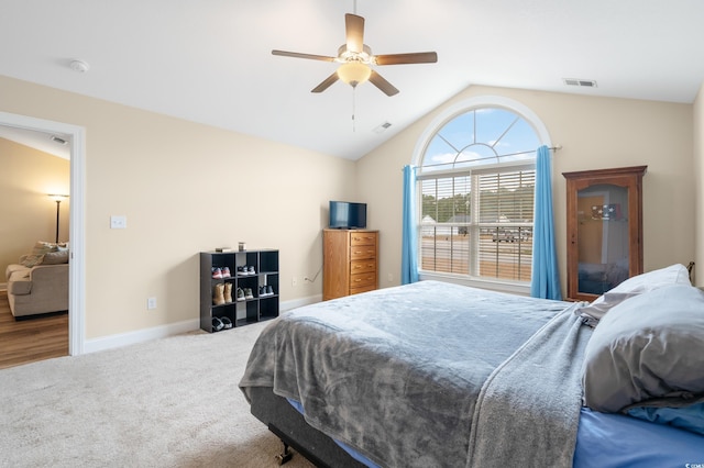 bedroom with ceiling fan, carpet, and lofted ceiling