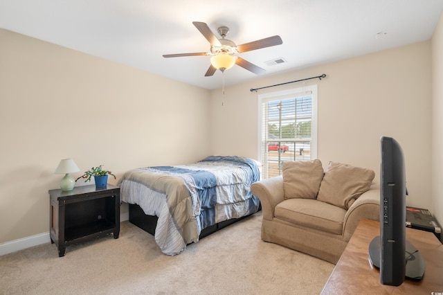 bedroom featuring ceiling fan and light colored carpet