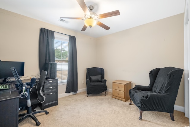 office space featuring ceiling fan and light colored carpet