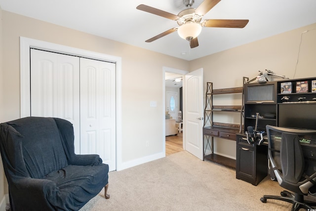 carpeted office with ceiling fan