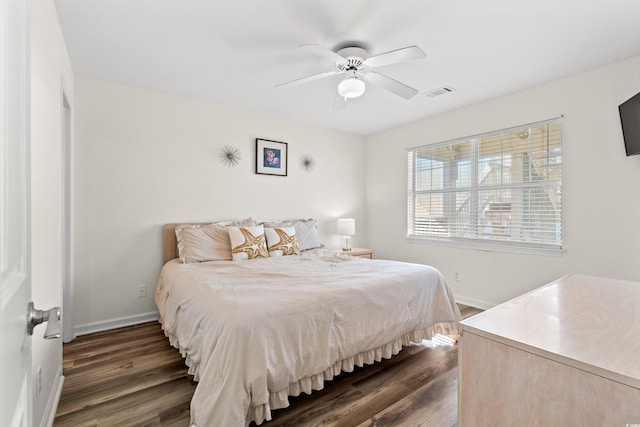 bedroom featuring ceiling fan and dark wood-type flooring