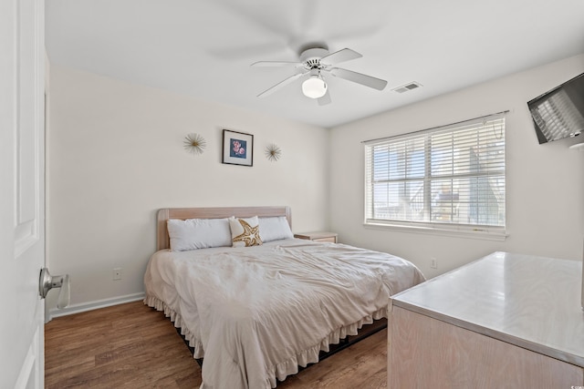 bedroom featuring hardwood / wood-style floors and ceiling fan