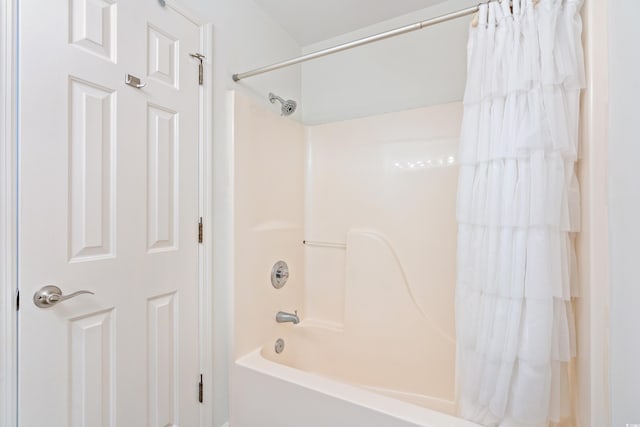 bathroom featuring shower / tub combo with curtain