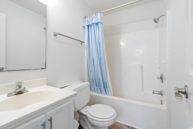 full bathroom with toilet, hardwood / wood-style floors, vanity, and shower / tub combo with curtain