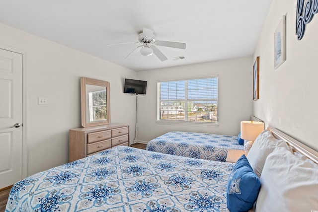 bedroom featuring hardwood / wood-style floors and ceiling fan