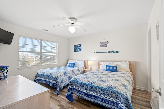 bedroom featuring ceiling fan and hardwood / wood-style flooring