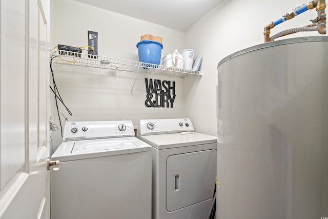 washroom featuring washing machine and clothes dryer