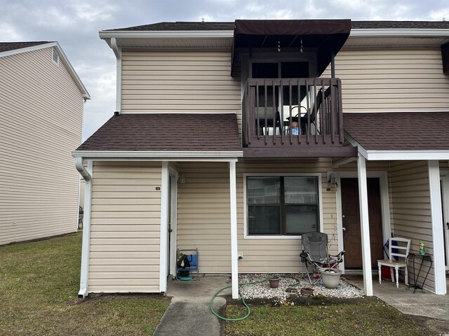 rear view of house with a balcony