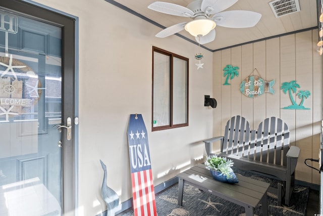 doorway to property with ceiling fan