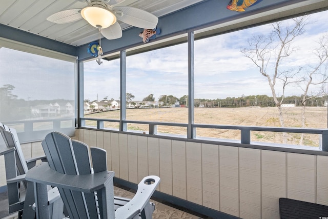 sunroom with ceiling fan and plenty of natural light