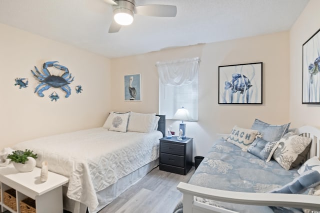 bedroom featuring ceiling fan and light wood-type flooring