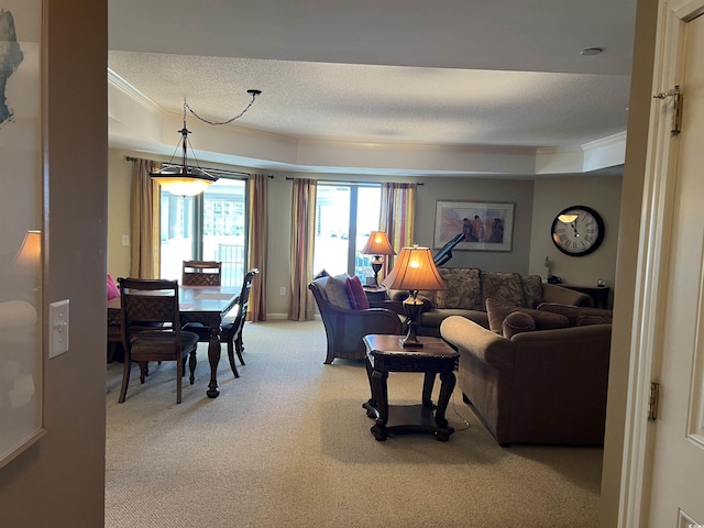 carpeted living room featuring a textured ceiling and crown molding