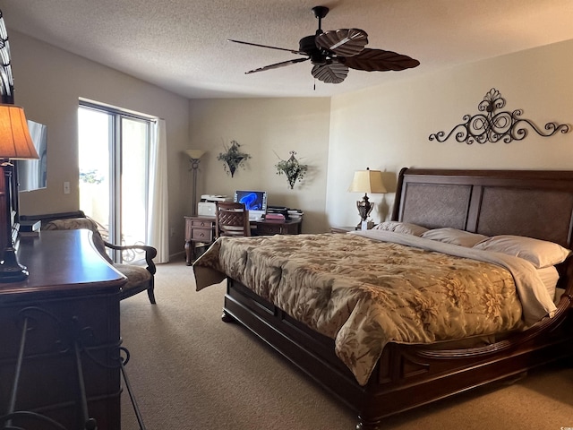 bedroom with carpet flooring, ceiling fan, and a textured ceiling