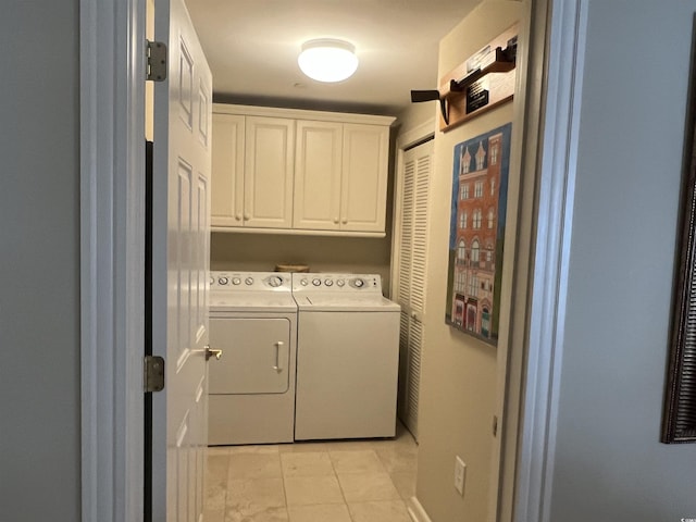 laundry area featuring cabinets and independent washer and dryer