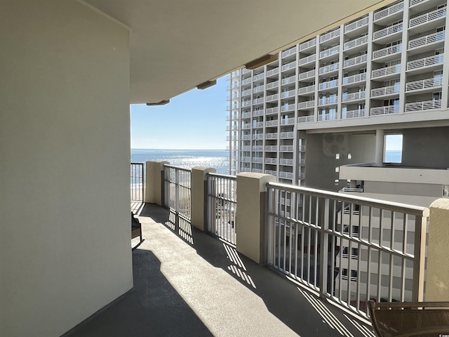 balcony featuring a water view