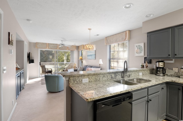 kitchen with kitchen peninsula, dishwasher, light colored carpet, and sink