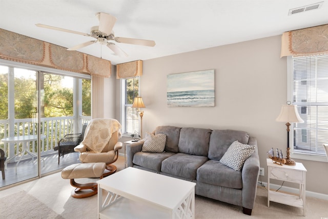 living room featuring ceiling fan and light carpet