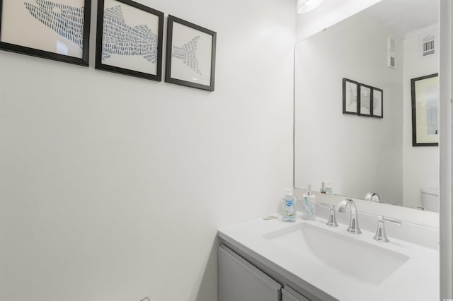 bathroom with vanity and toilet