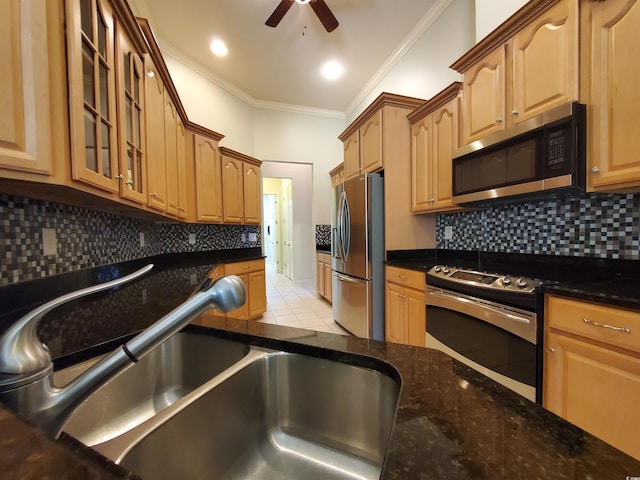 190 Sugar Loaf Ln, Murrells Inlet, SC 29576 - kitchen with appliances with stainless steel finishes, ceiling fan, ornamental molding, glass insert cabinets, and dark stone counters