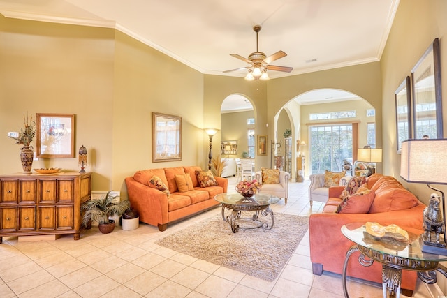 living room featuring light tile patterned floors, ceiling fan, and ornamental molding