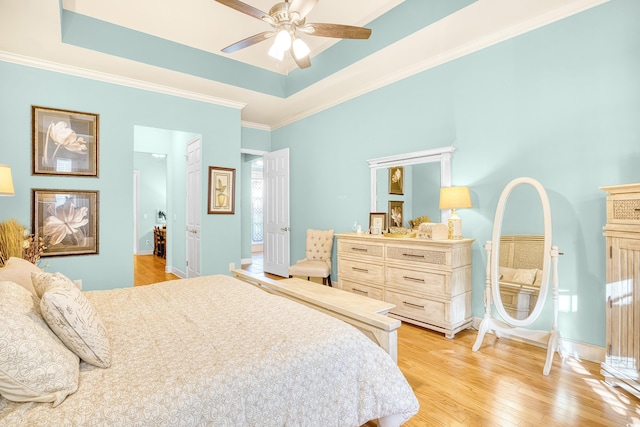 190 Sugar Loaf Ln, Murrells Inlet, SC 29576 - bedroom with a raised ceiling, light wood-type flooring, crown molding, and ceiling fan