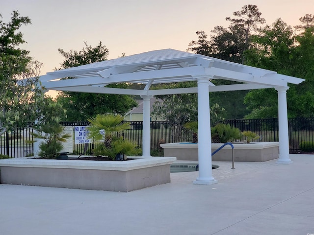 190 Sugar Loaf Ln, Murrells Inlet, SC 29576 - patio terrace at dusk featuring a jacuzzi and a gazebo