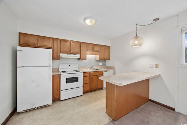 kitchen with white appliances, decorative backsplash, sink, hanging light fixtures, and kitchen peninsula