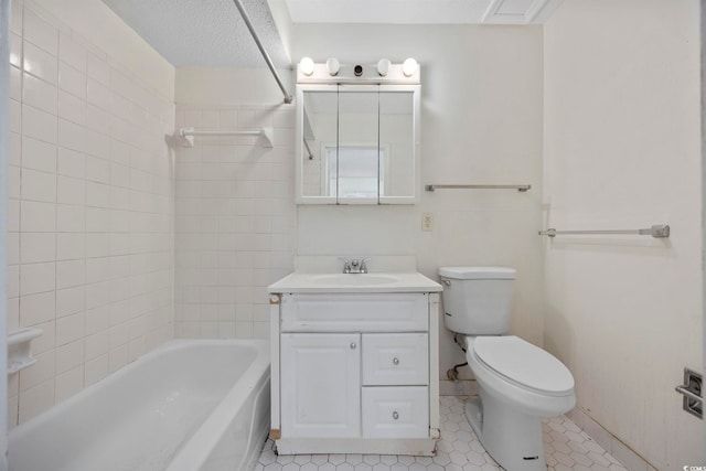 full bathroom with toilet, vanity, tile patterned flooring, tiled shower / bath combo, and a textured ceiling