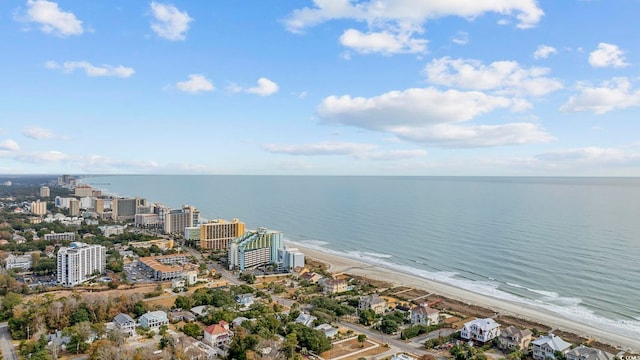 bird's eye view featuring a water view and a view of the beach