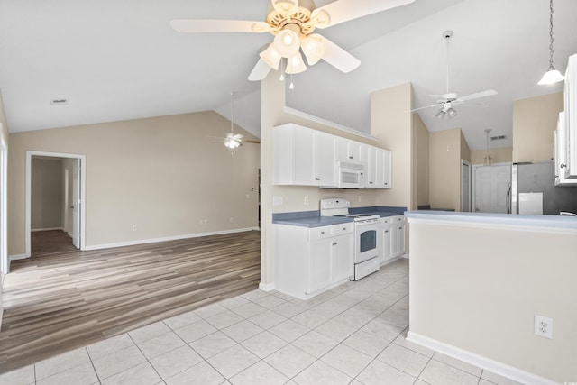 kitchen with light tile patterned floors, white appliances, white cabinetry, and ceiling fan