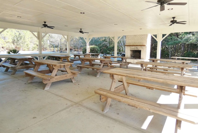 64 Summerlight Dr, Murrells Inlet, SC 29576 - view of patio featuring ceiling fan and an outdoor brick fireplace