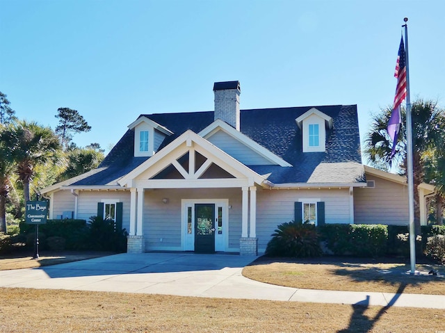 64 Summerlight Dr, Murrells Inlet, SC 29576 - view of front of home featuring a shingled roof and a chimney