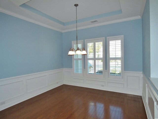 64 Summerlight Dr, Murrells Inlet, SC 29576 - empty room with wainscoting, a tray ceiling, dark wood finished floors, and a notable chandelier