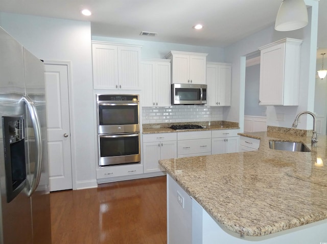 64 Summerlight Dr, Murrells Inlet, SC 29576 - kitchen with stainless steel appliances, white cabinets, a sink, visible vents, and dark wood-type flooring