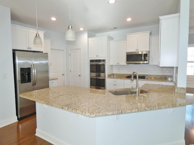 64 Summerlight Dr, Murrells Inlet, SC 29576 - kitchen with tasteful backsplash, a sink, appliances with stainless steel finishes, visible vents, and dark wood finished floors