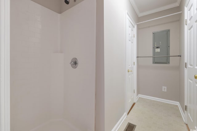 bathroom with electric panel, crown molding, and walk in shower